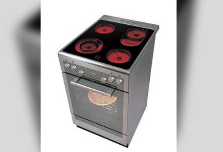 Electric hob and oven with a dark cooktop.